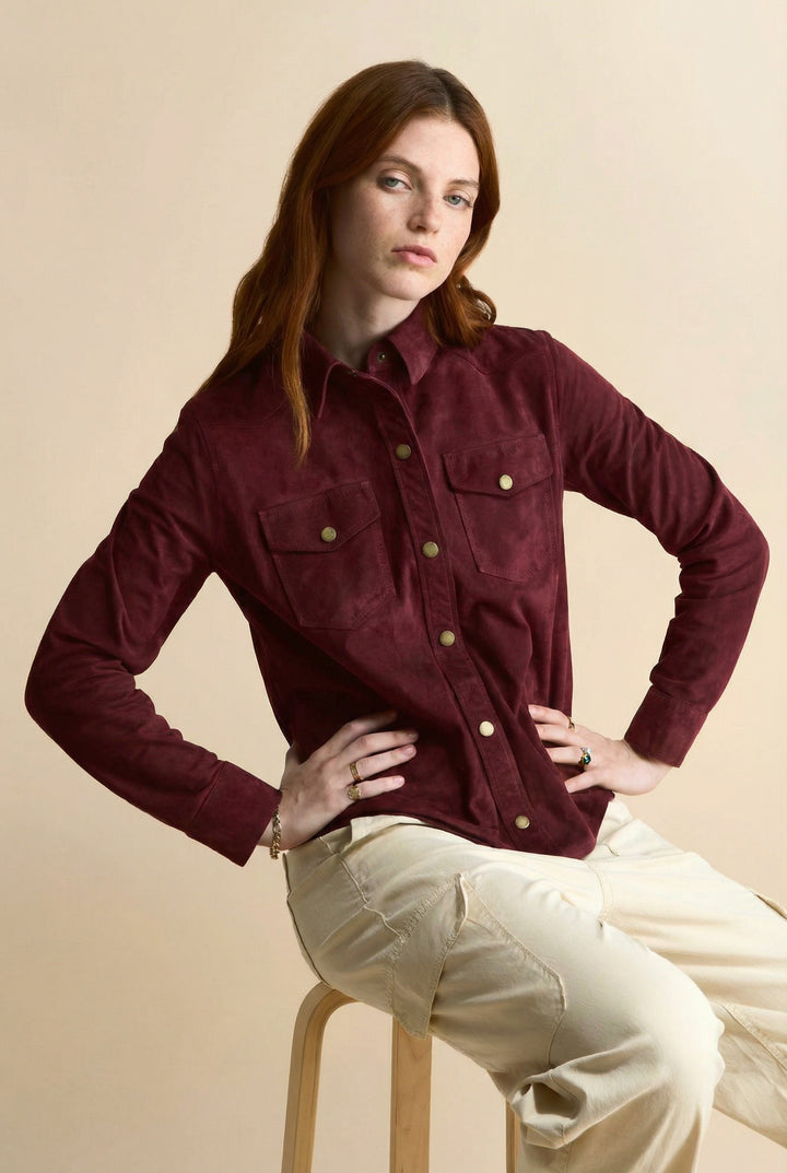Women’s burgundy suede shirt styled with neutral pants for elevated everyday wear