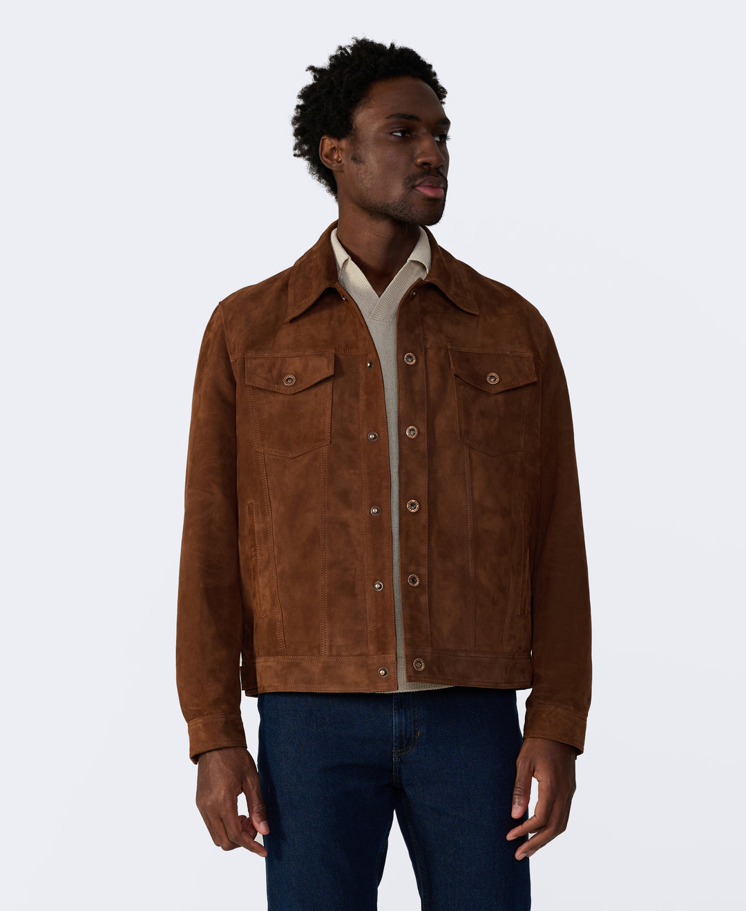 Man wearing a brown suede jacket on a white background