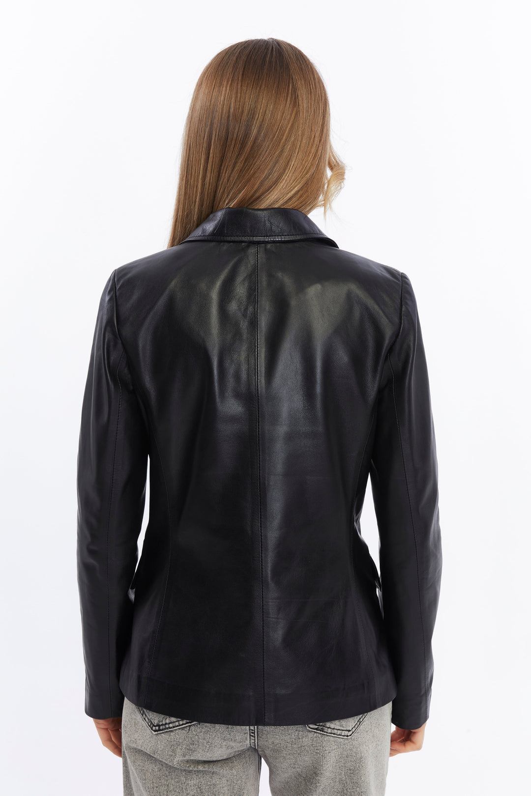 Back of black leather jacket on model