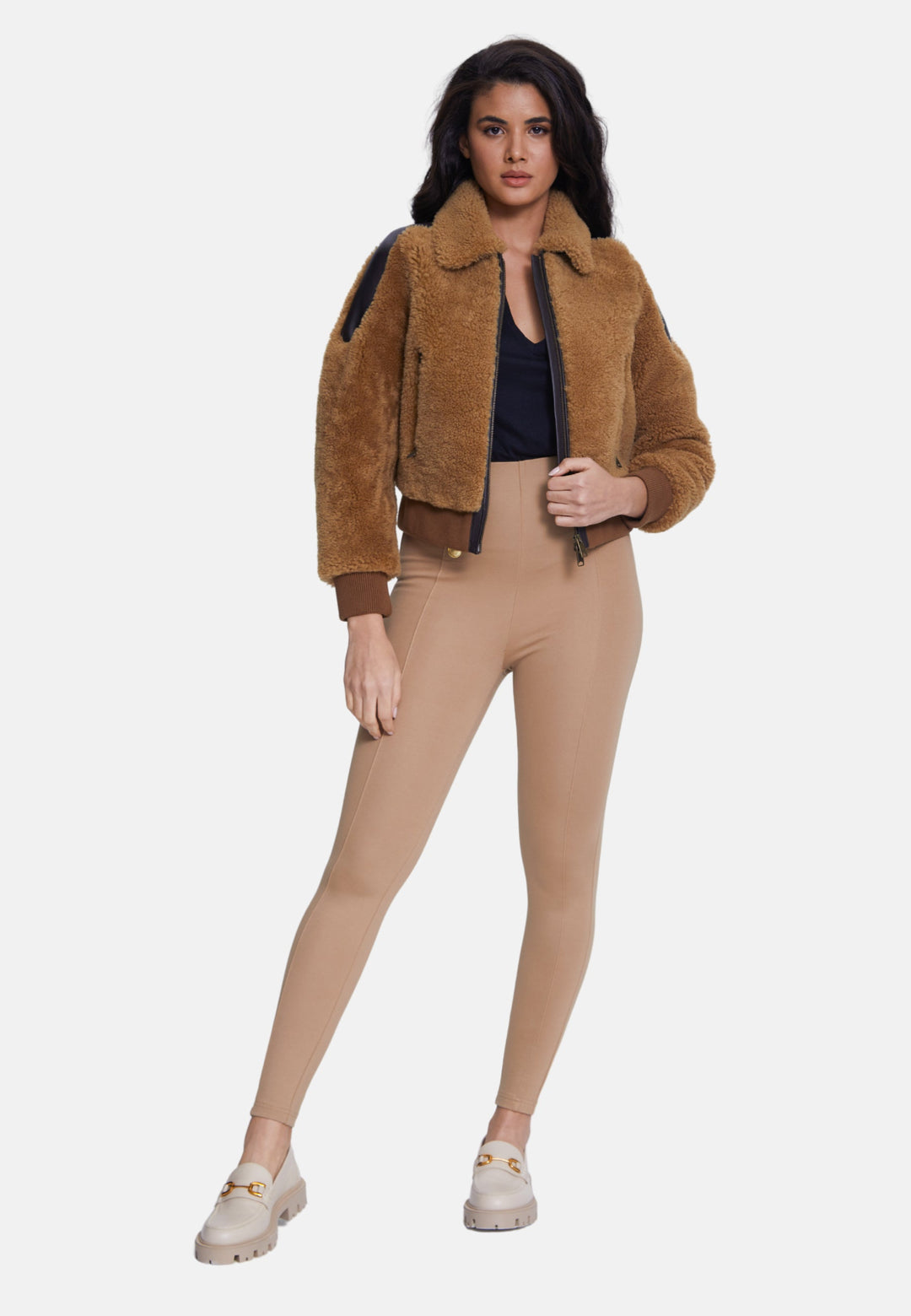 Woman wearing brown shearling teddy jacket