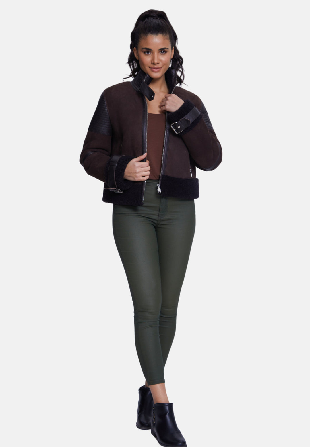 Woman wearing brown shearling jacket