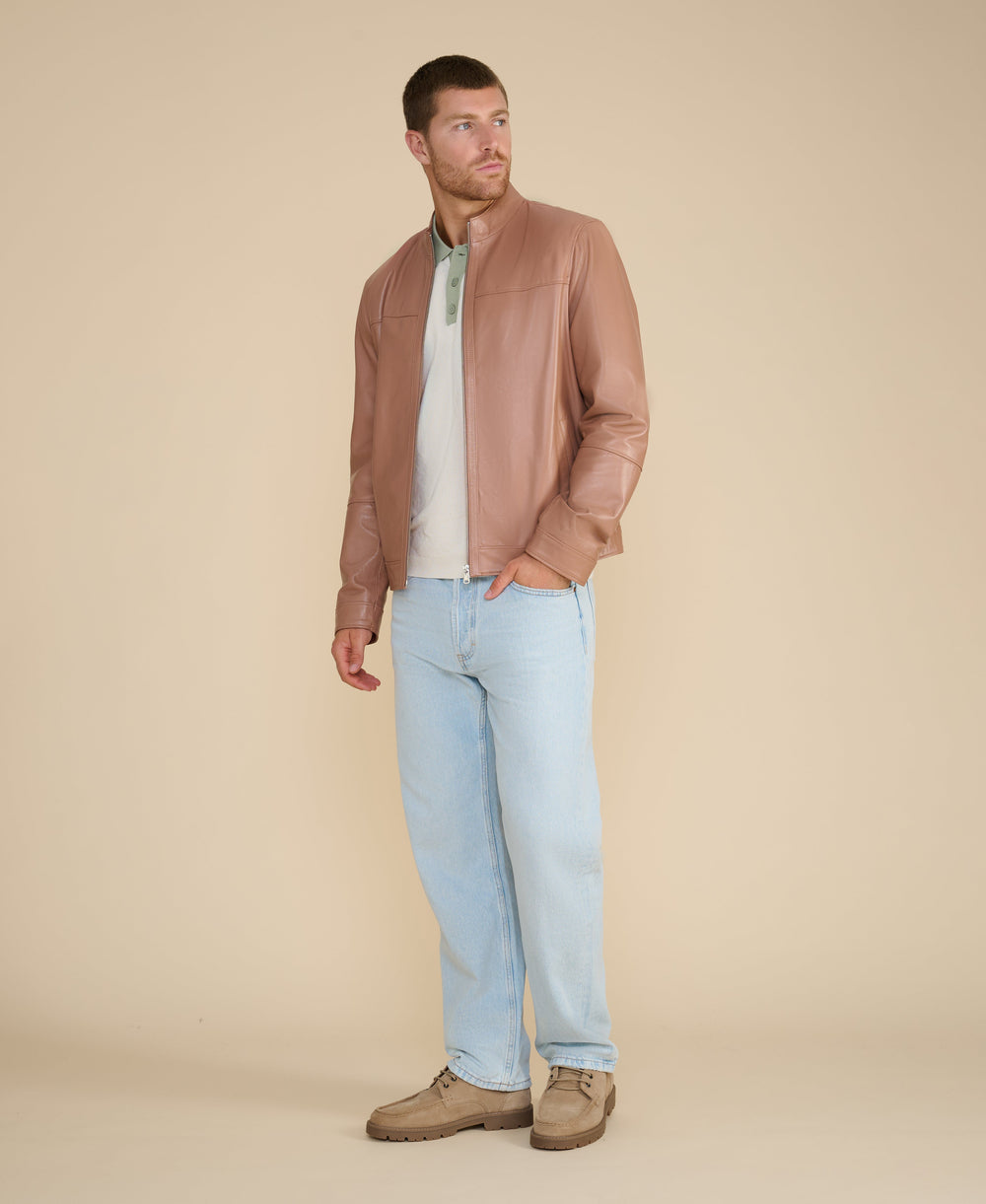 Man in tan leather racer jacket