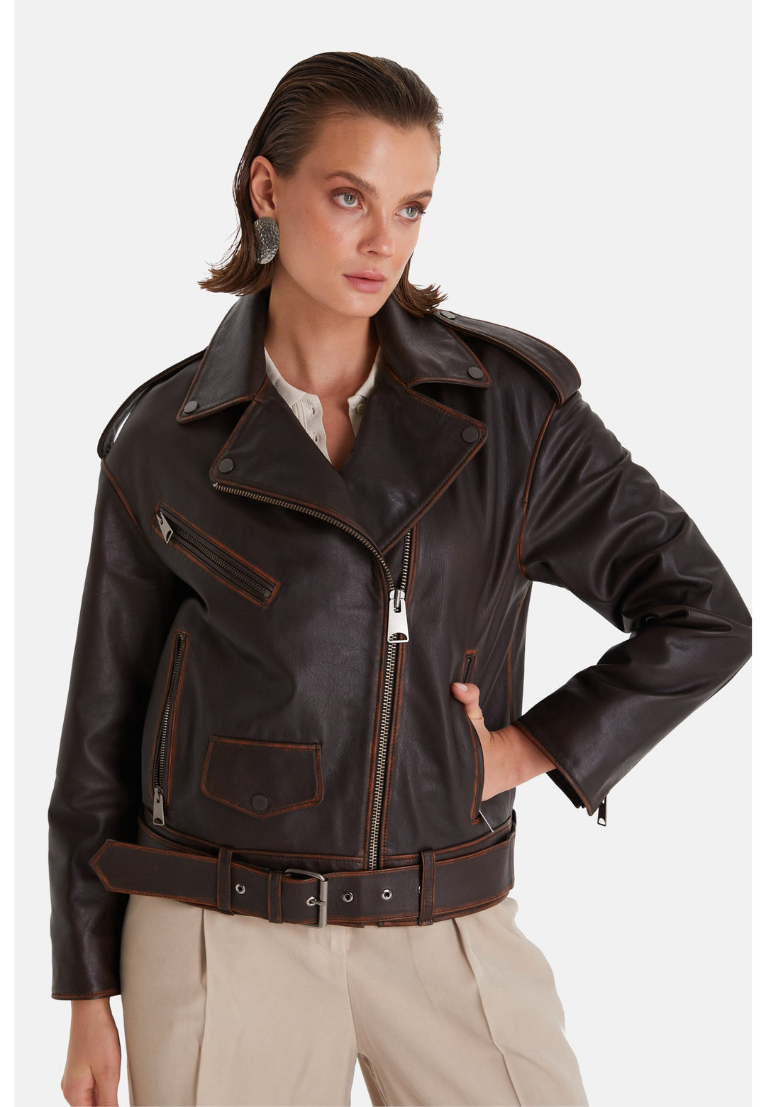 Woman wearing dark brown leather biker jacket