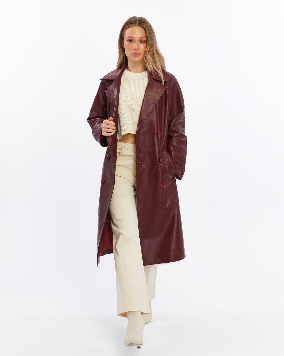 Woman wearing burgundy leather trench coat