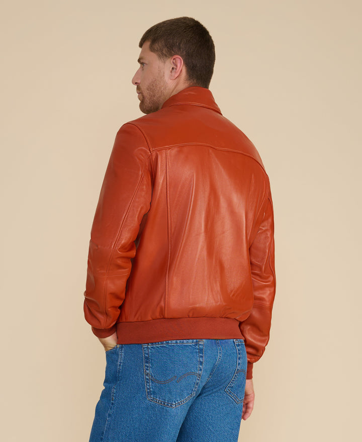Back of cognac leather bomber jacket
