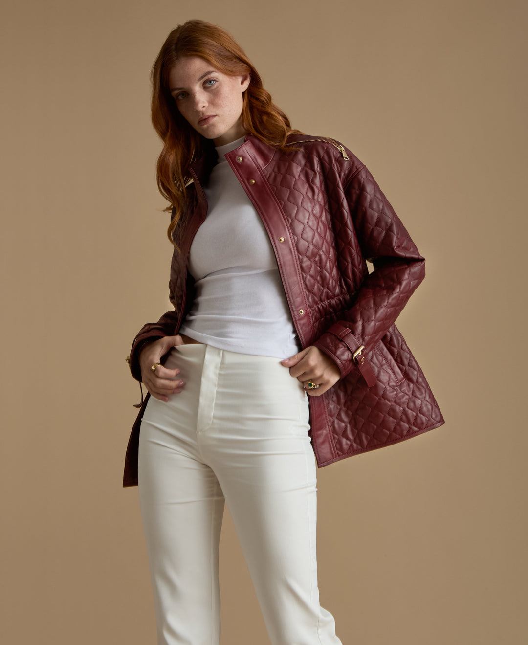 Burgundy quilted leather coat on model