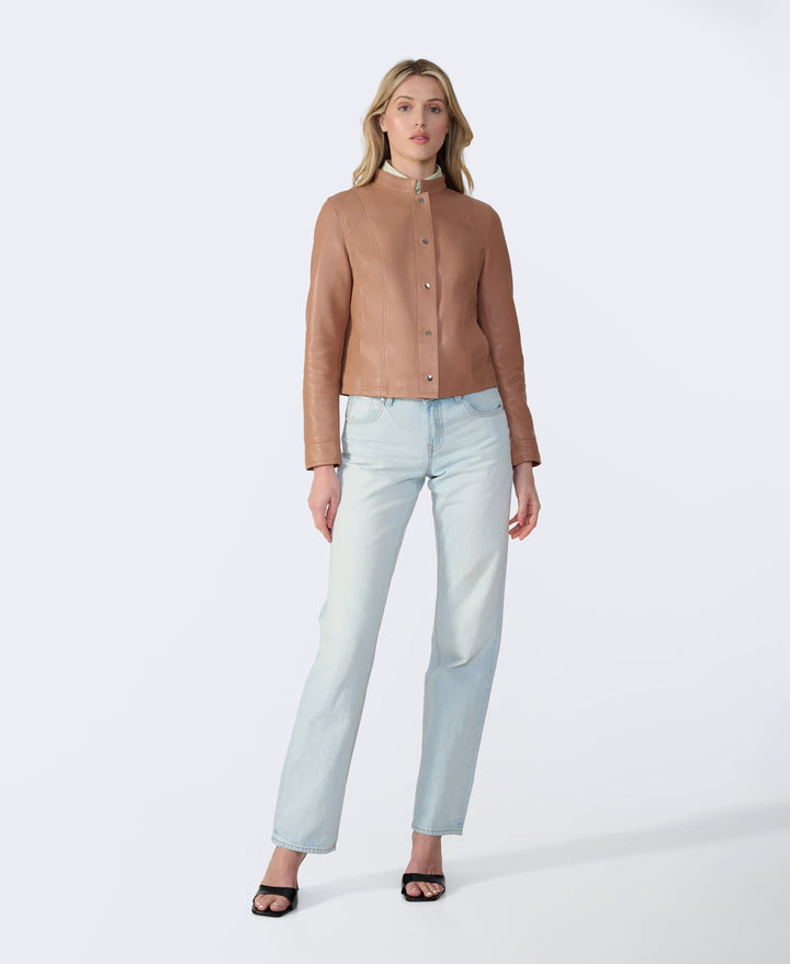 Woman wearing tan leather jacket