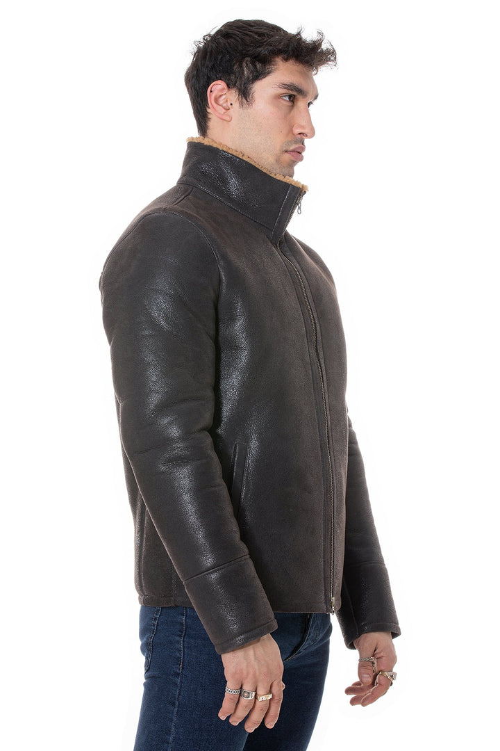 Male model wearing dark sheepskin jacket