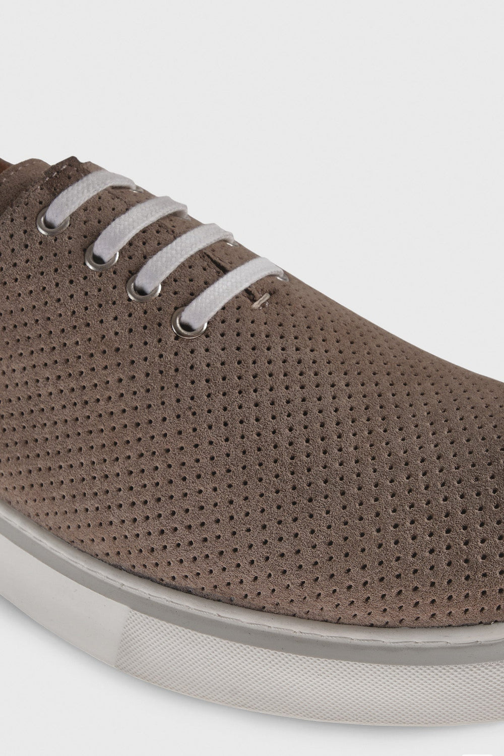 Brown perforated suede low-top sneaker