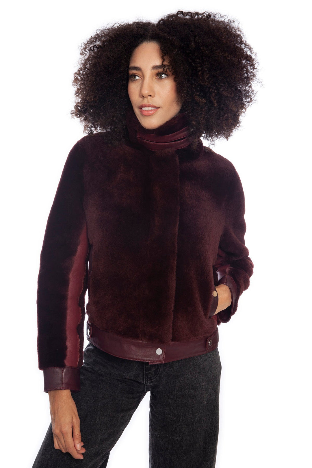 Woman wearing burgundy shearling jacket
