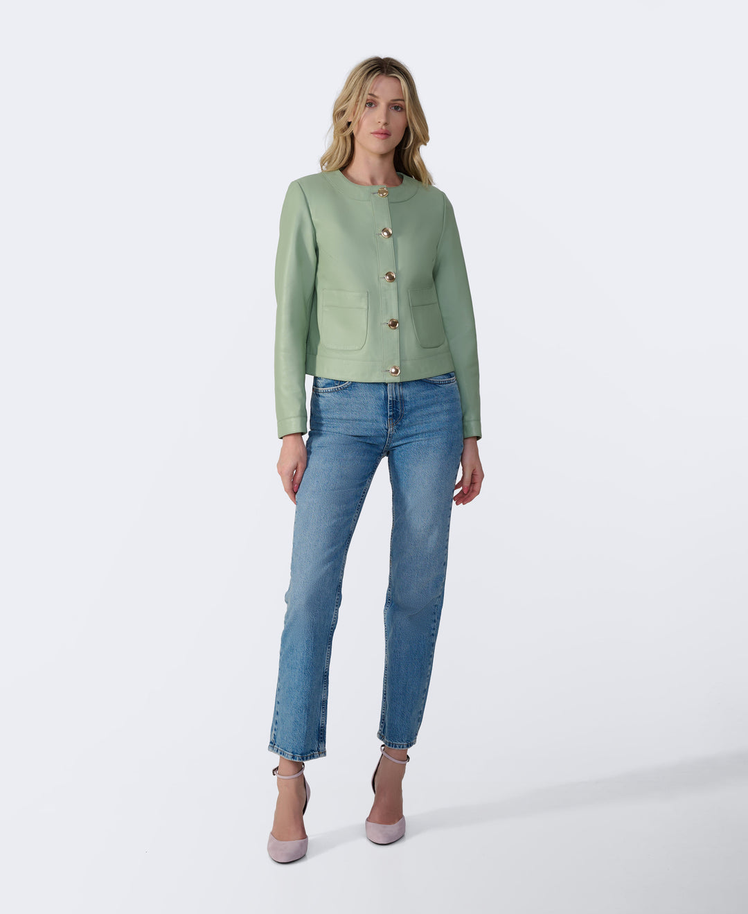 Woman wearing mint green leather jacket