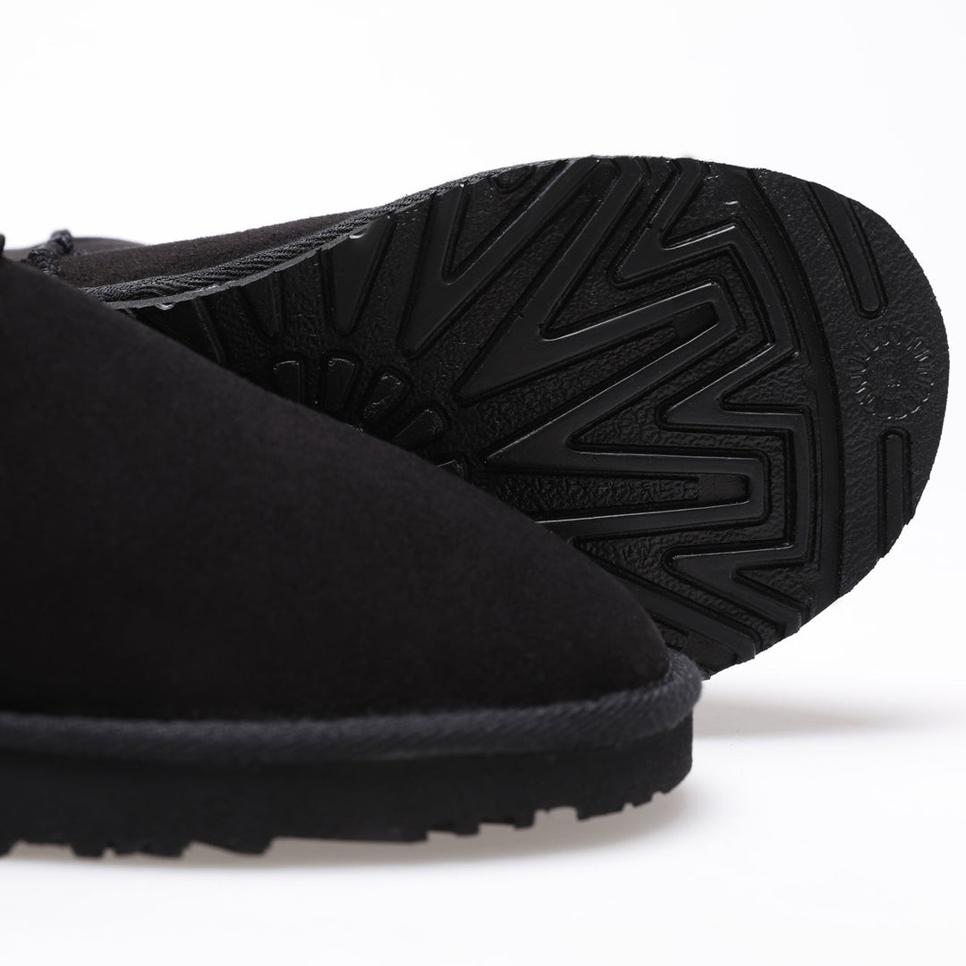 Black suede sheepskin boot close-up
