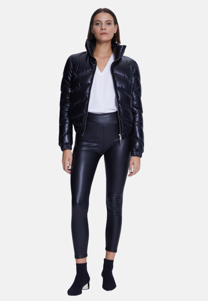 Woman wearing black padded leather jacket