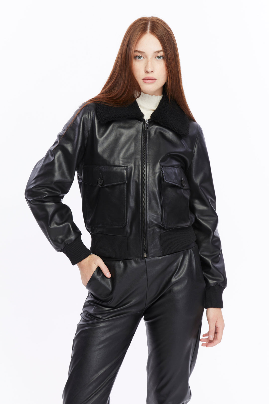 Woman wearing black leather bomber jacket