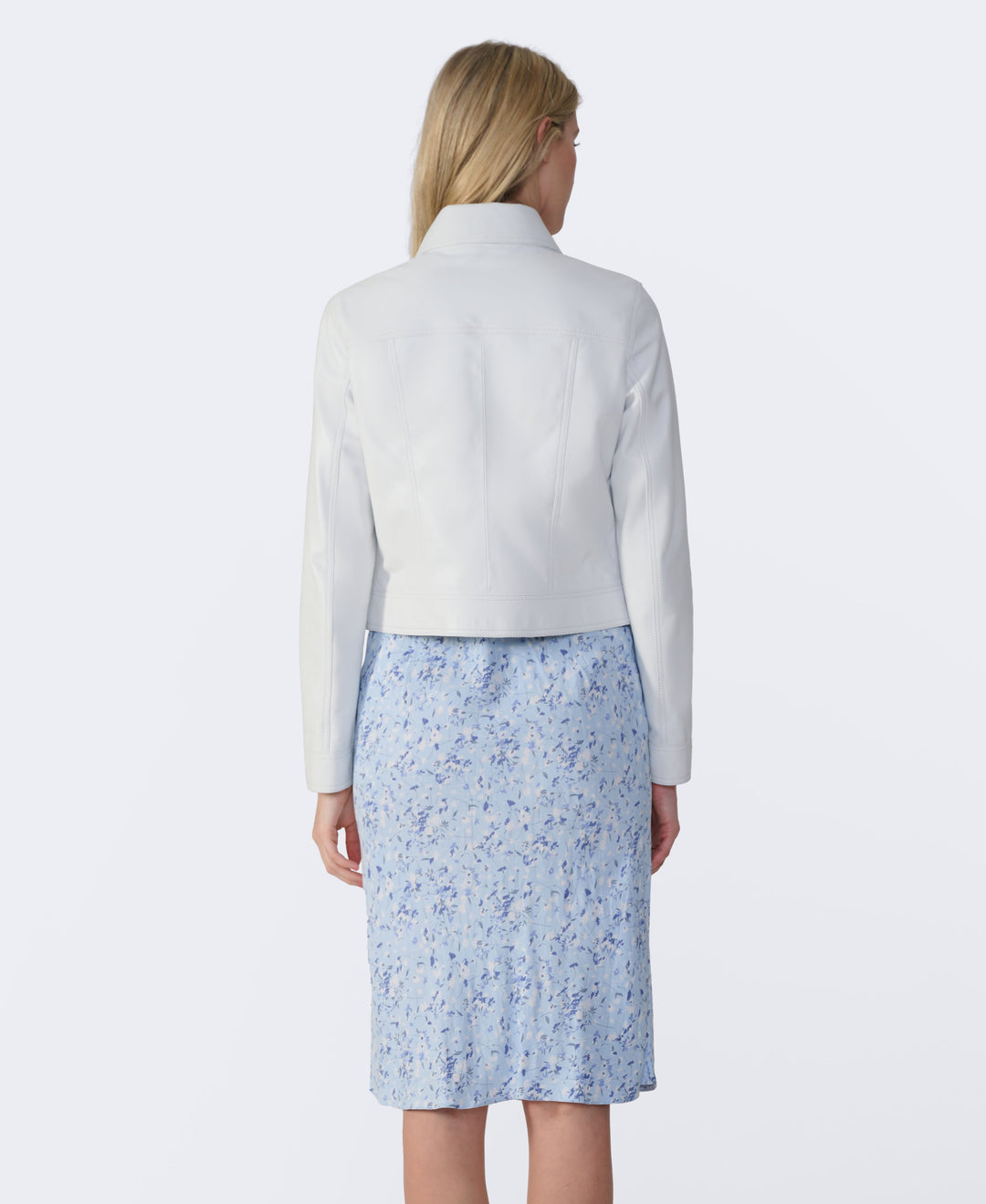 Woman wearing white cropped leather jacket