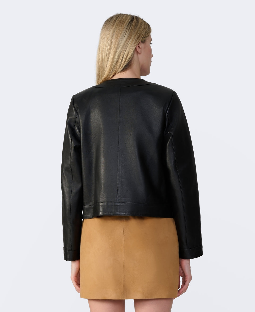 Black leather jacket back view on model