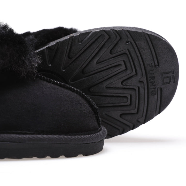 Black sheepskin slip-on shoe close-up