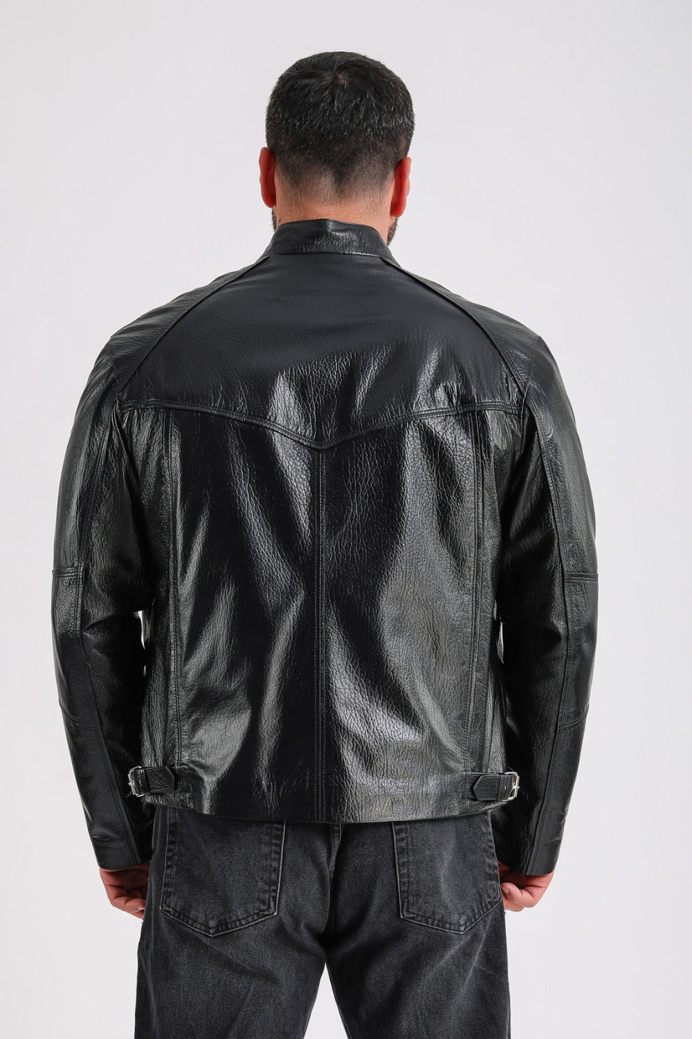 Man wearing black leather jacket (back)