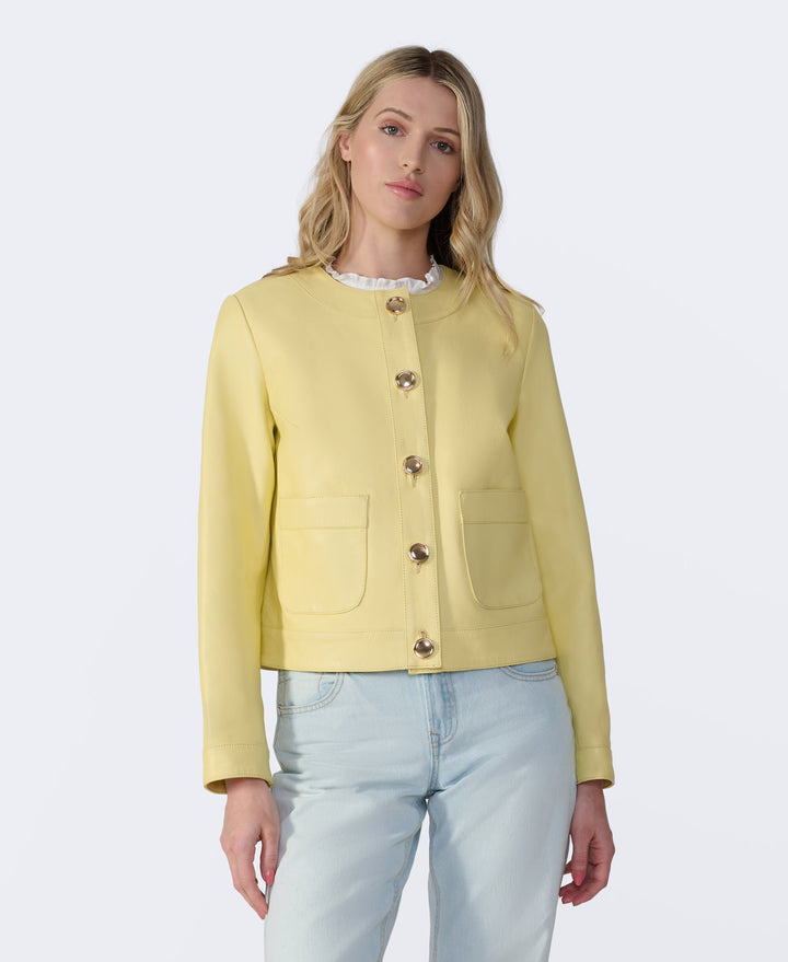 Pastel yellow leather jacket on model