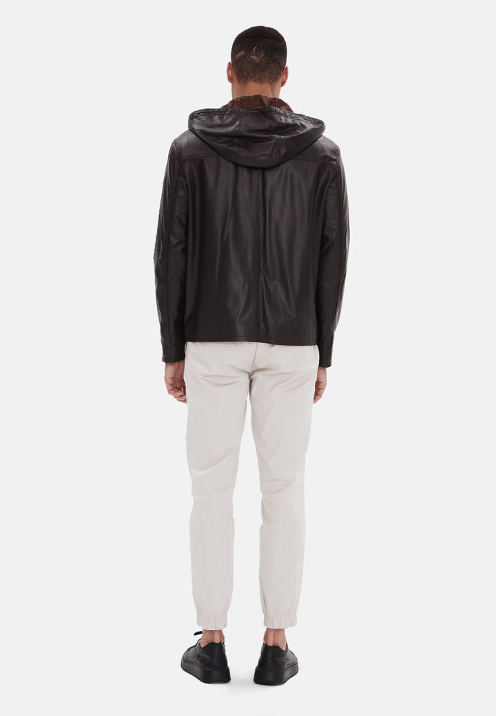 Man wearing black leather hooded jacket (back)