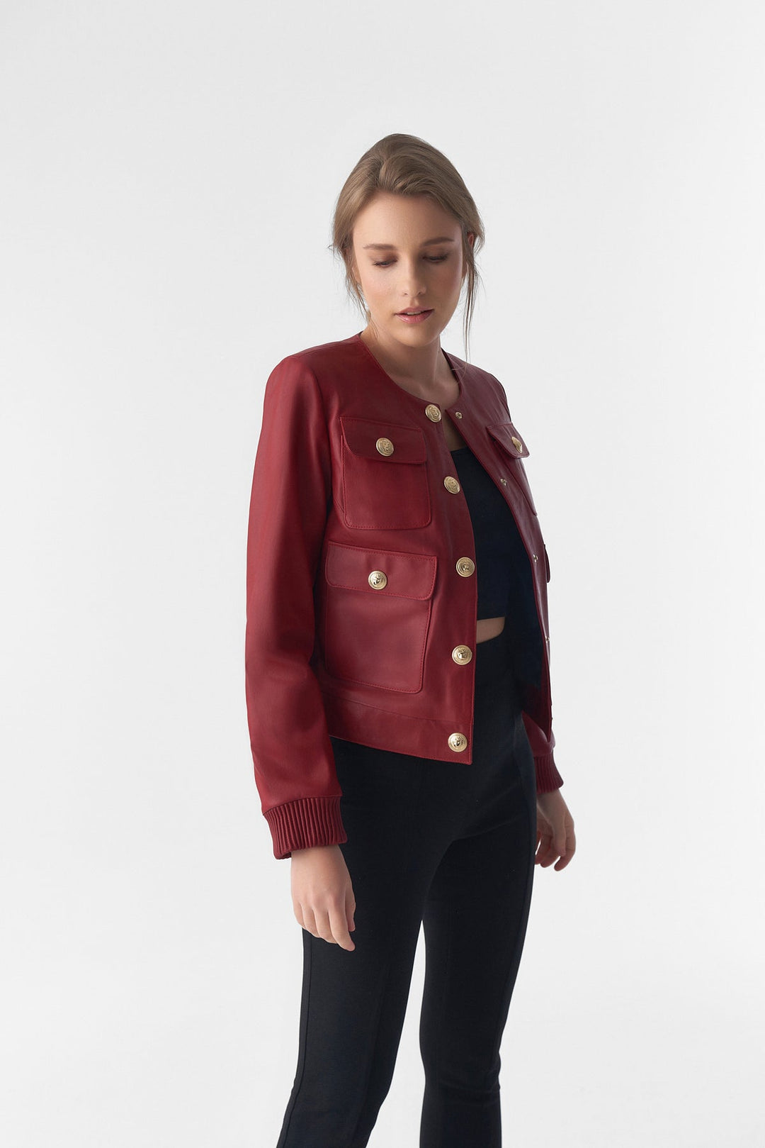 Woman wearing red cropped leather jacket