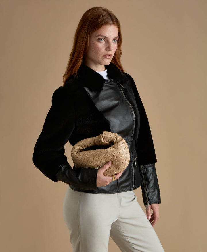 Woman wearing black leather jacket