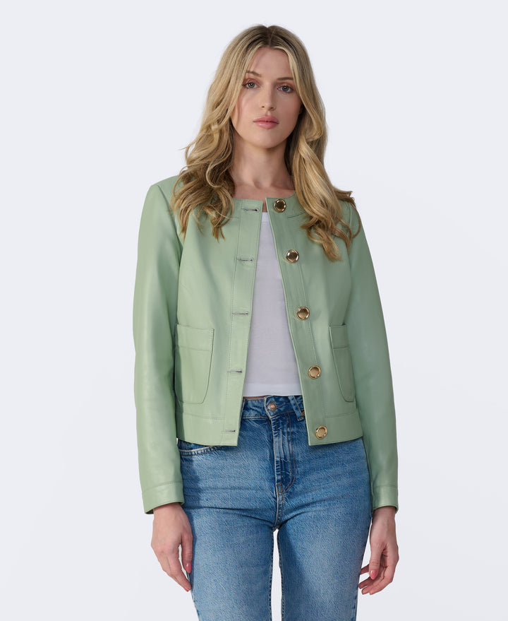 Woman wearing mint green leather jacket