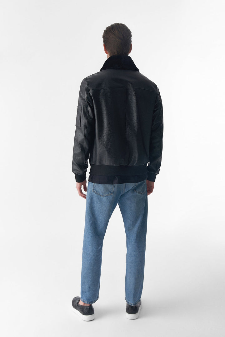 Man wearing black leather jacket - back view