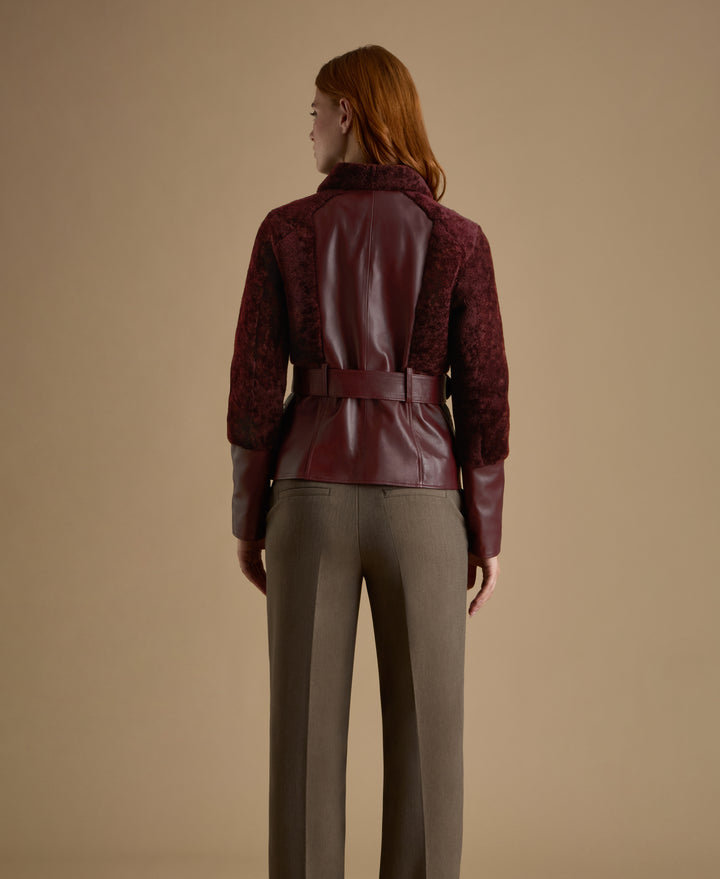 Back view of Alice burgundy leather and shearling jacket with sculpted silhouette