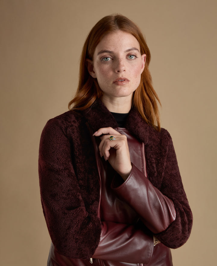 Portrait detail of Alice burgundy leather and shearling jacket crafted from British leather