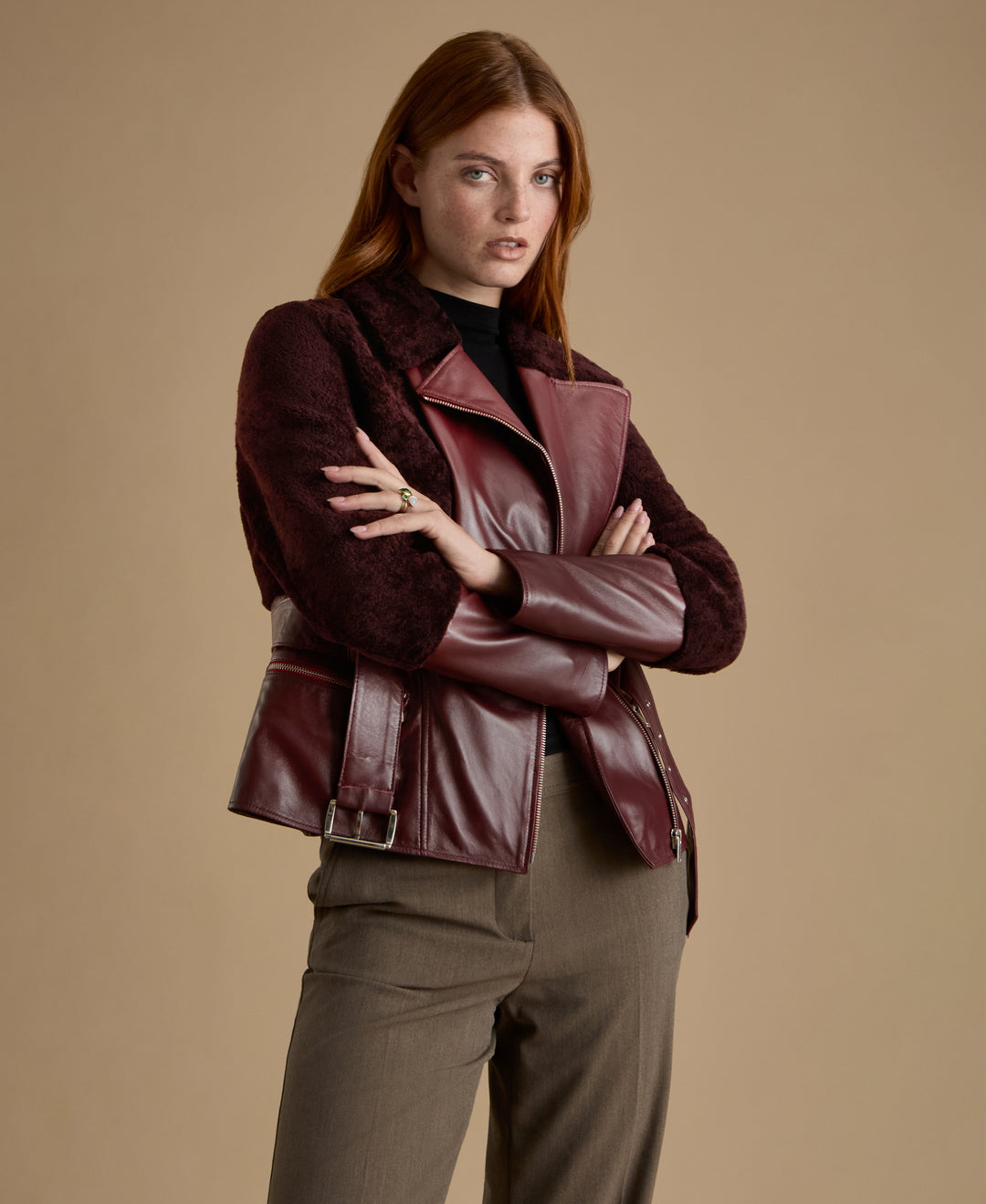 Woman wearing Alice burgundy leather and shearling jacket from FURNIQ UK Fall Winter 2026/27 collection