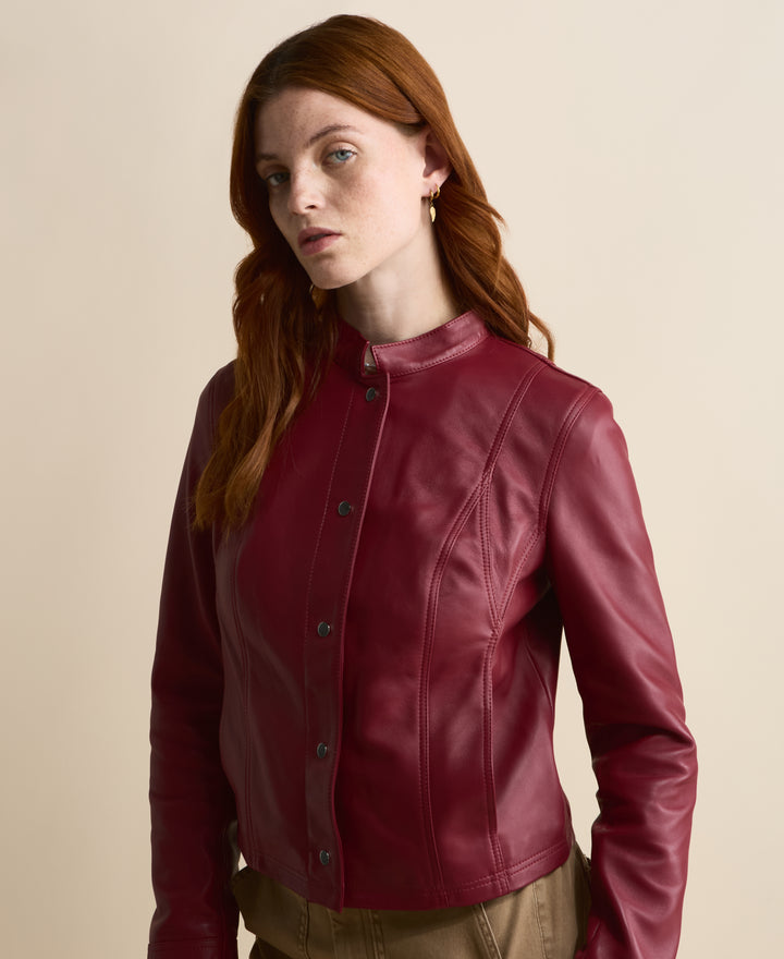 Close-up of Amelia light burgundy leather jacket with stand collar and panel seams