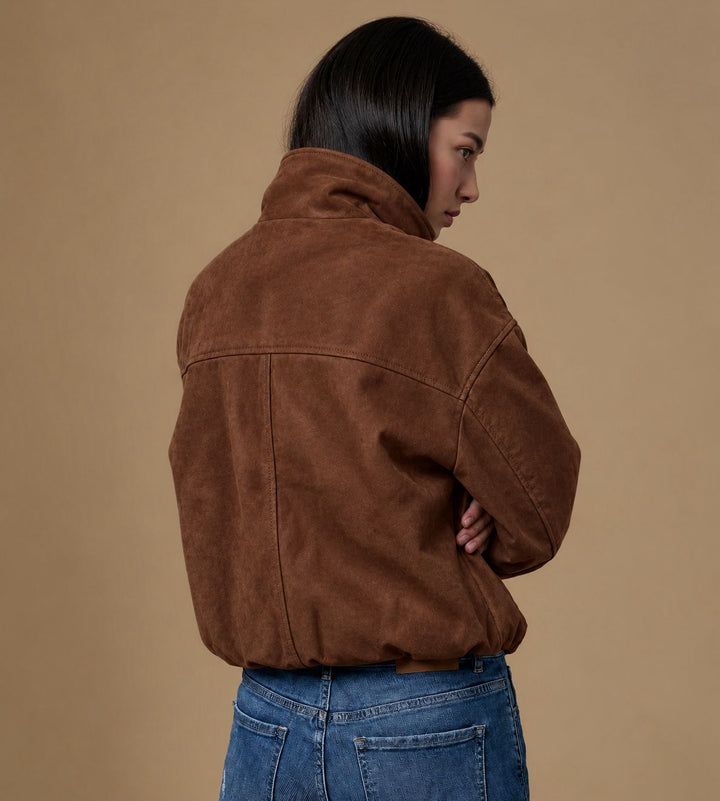 Back view of the Arden chestnut brown suede jacket showing dropped shoulders, panel seams and gathered hem.
