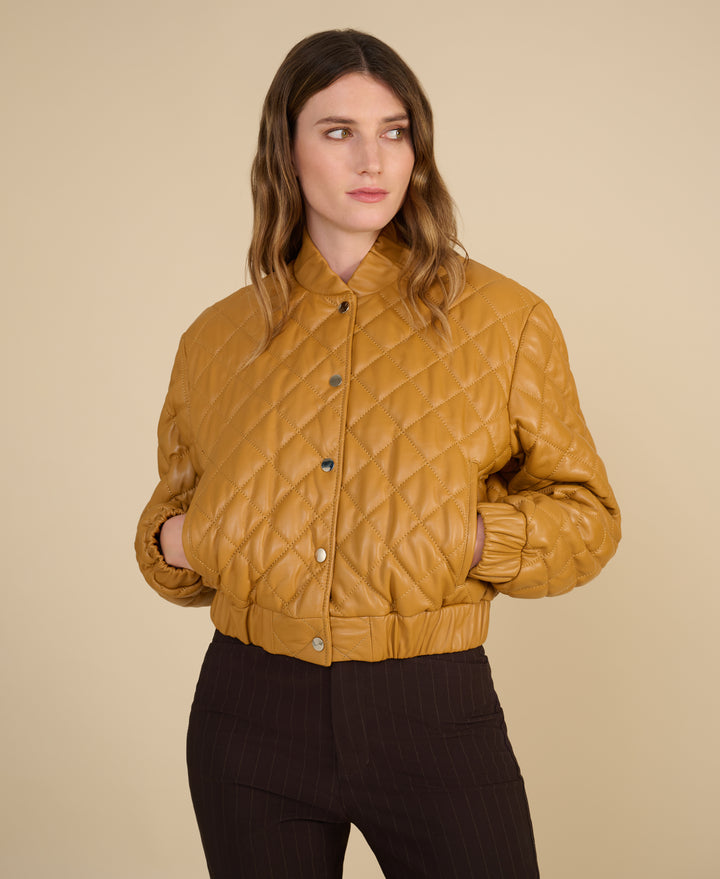 Close-up of diamond quilting on Aveline caramel leather jacke