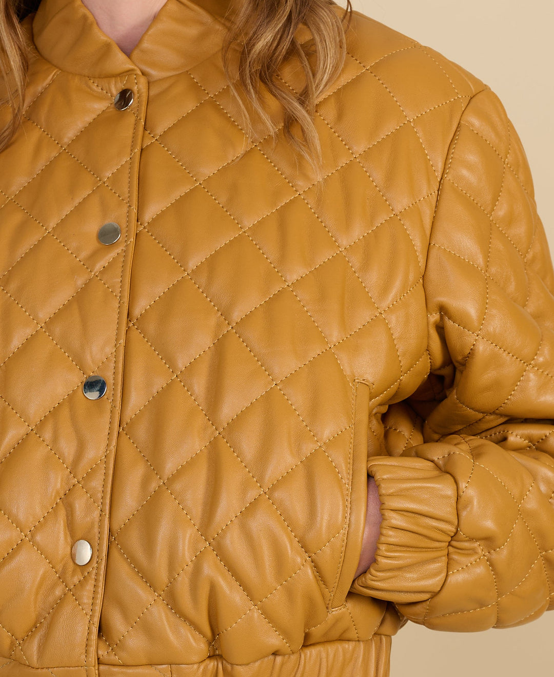 Close-up of diamond quilting on Aveline caramel leather jacket