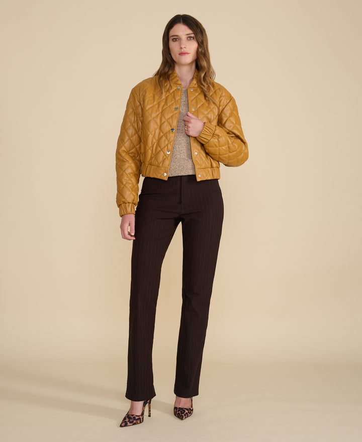 Full-length view of Aveline caramel quilted leather jacket