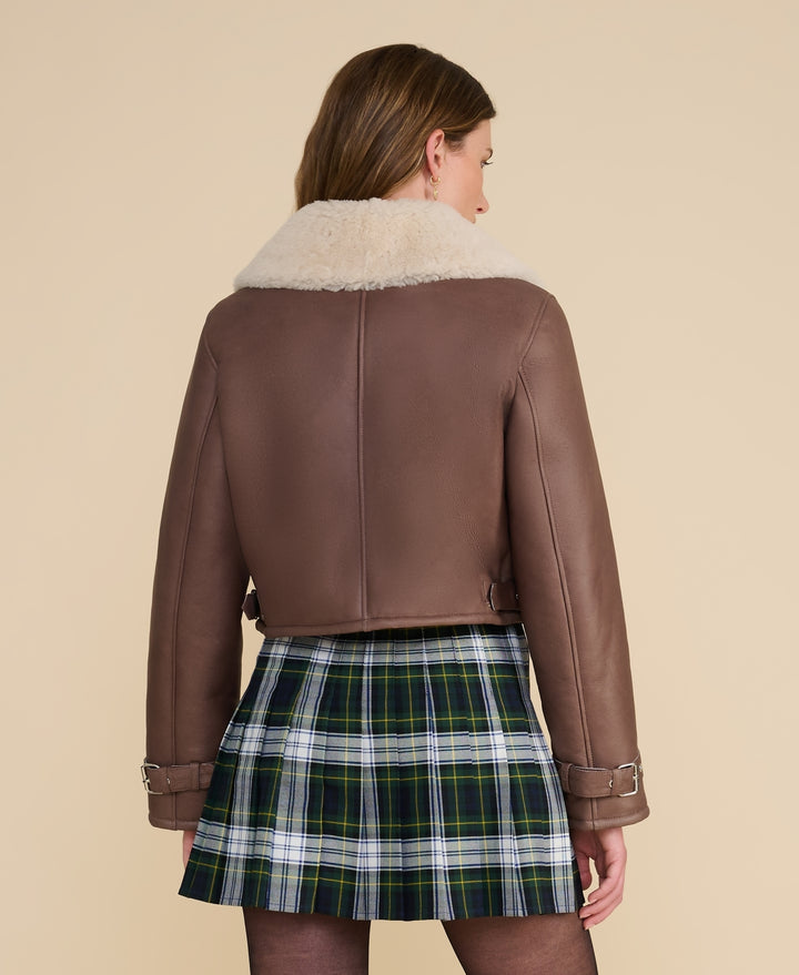 Back view of Avery brown shearling aviator jacket in brown leather with adjustable side tabs