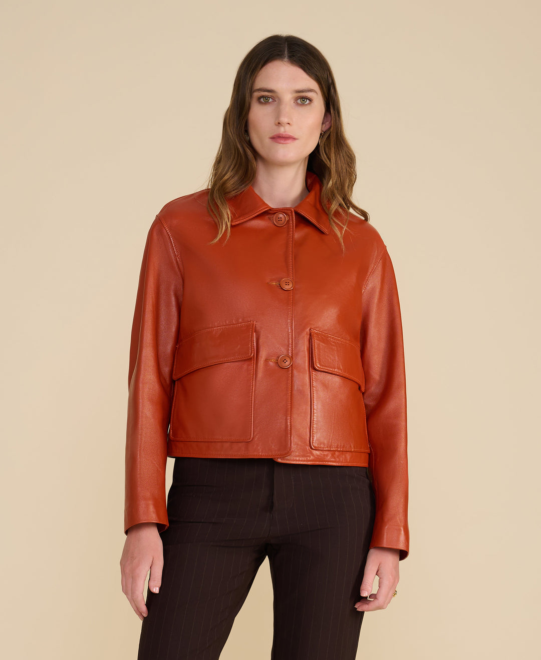 Rust leather button-front jacket on model