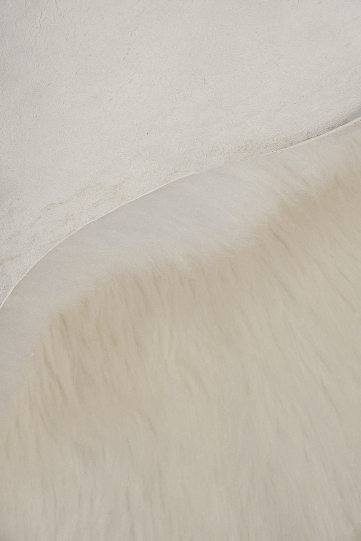 Natural white sheepskin rug close-up