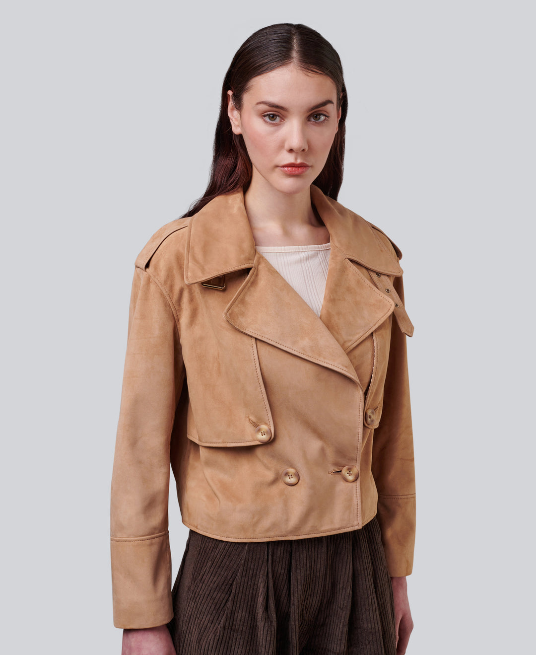 Tan suede cropped jacket on model