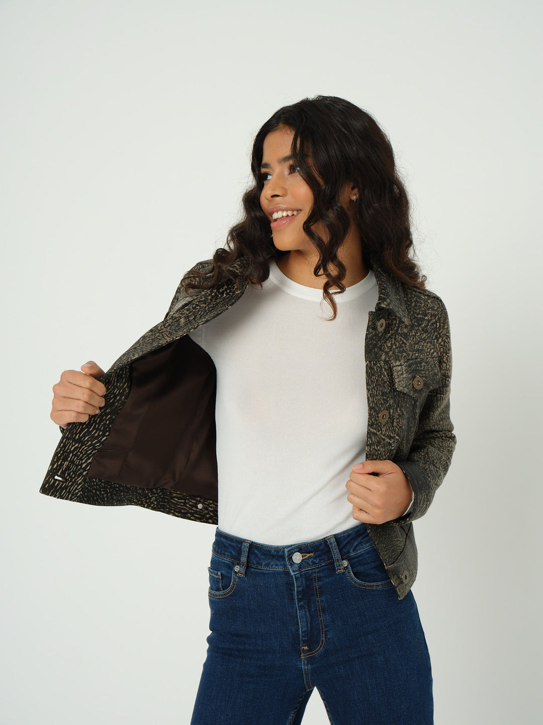 Woman wearing olive patterned leather jacket