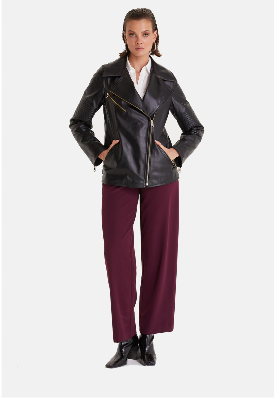 Woman wearing black leather biker jacket