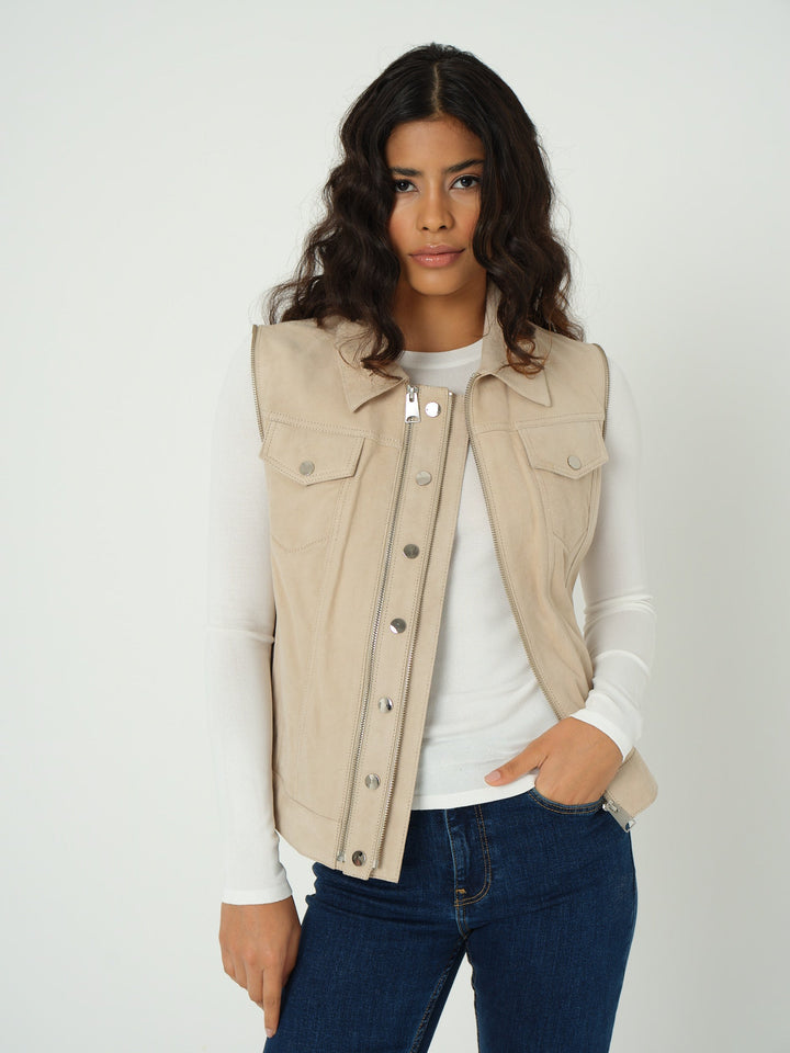 Beige suede sleeveless jacket on model