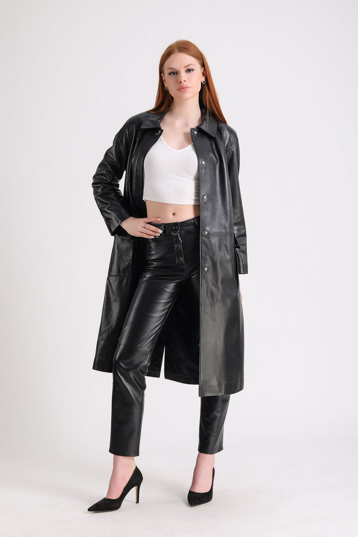 Woman wearing black leather trench coat