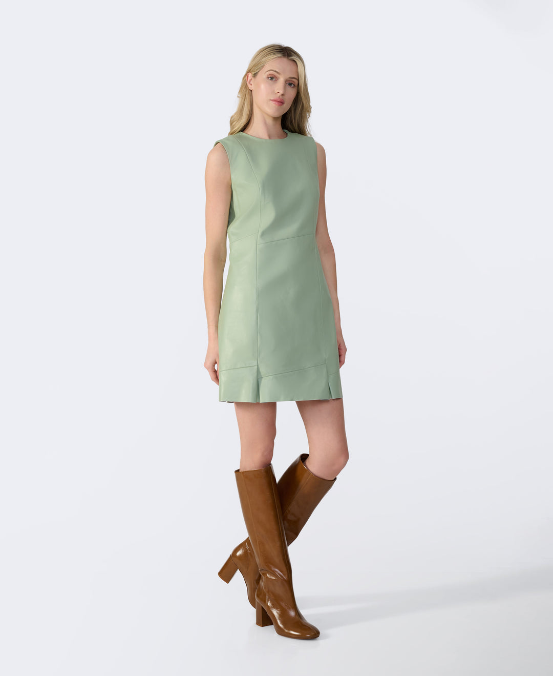 Woman in mint leather dress