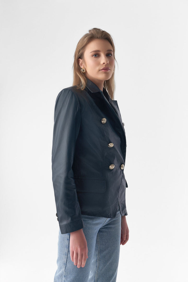 Woman wearing blue leather blazer