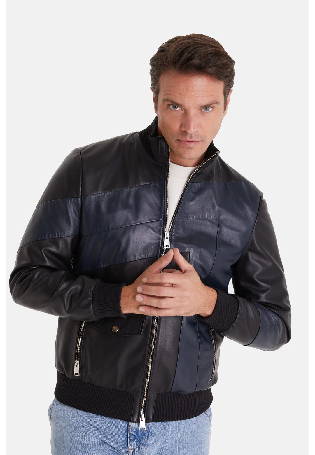 Man wearing black and navy leather jacket