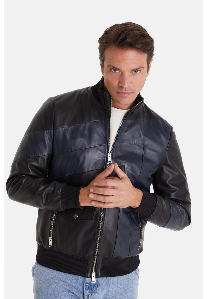 Man wearing black and navy leather jacket
