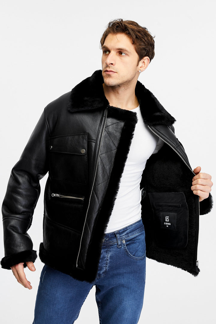 Man wearing black shearling leather jacket