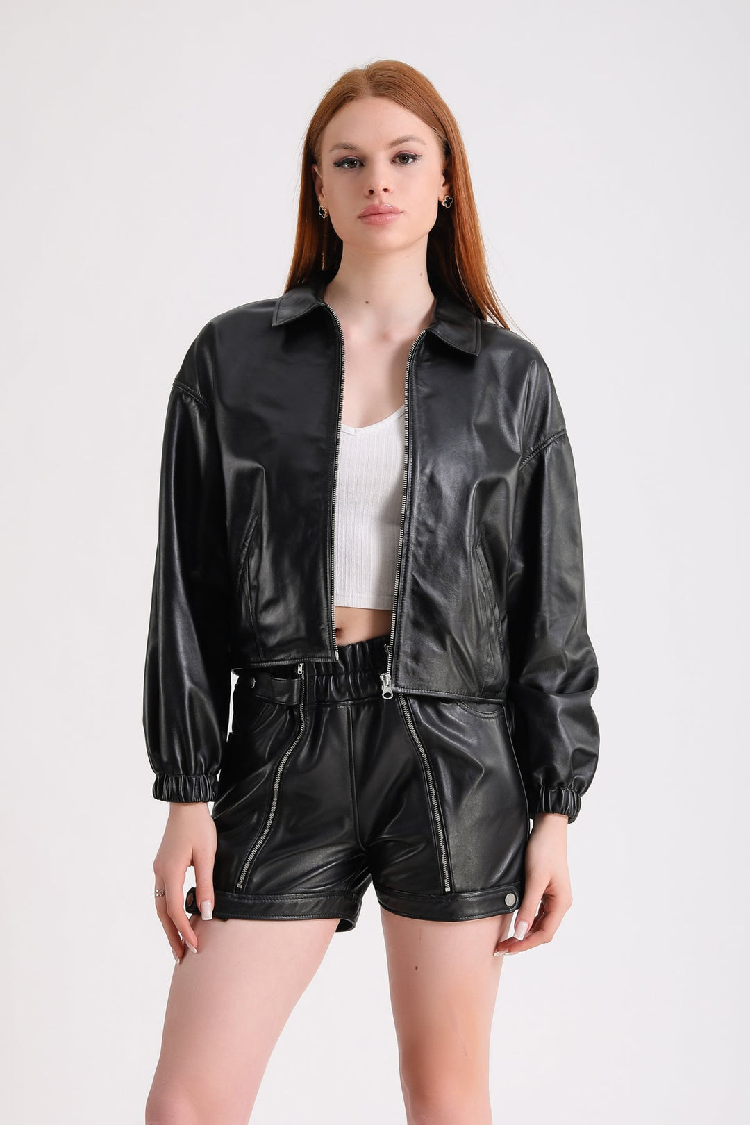 Woman wearing black leather jacket set